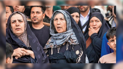 Residents look on as rescue workers search for bodies in the rubble of a residential building that was hit in an airstrike in Tehran 'Fearing ground assault, our families have started leaving Tehran': Iranians in India