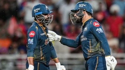 Gujarat Titans' Rashid Khan, right, and Rahul Tewatia during an Indian Premier League (IPL) 2026 T20 cricket match between Punjab Kings and Gujarat Titans (PTI)