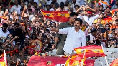 Tamilaga Vettri Kazhagam (TVK) chief Vijay waves the party flag during a public rally at Kolathur Assembly constituency ahead of Tamil Nadu Assembly Election, in Chennai. (PTI Photo/R Senthilkumar)(PTI03_30_2026_000282A) (PTI)