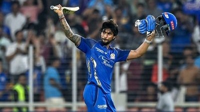Tilak Varma celebrates after scoring a century (100 runs) during the 2026 IPL match between Gujarat Titans and Mumbai Indians in Ahmedabad (AFP)