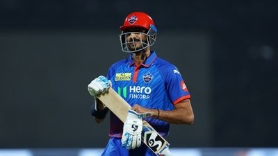 Delhi Capitals' Axar Patel looks dejected and walks back to the pavilion after losing his wicket (REUTERS)