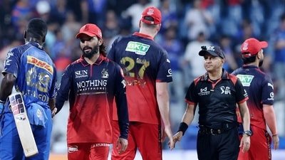Umpires shake hands with RCB and MI players after a 4h 22m match at the Wankhede Stadium. (REUTERS)