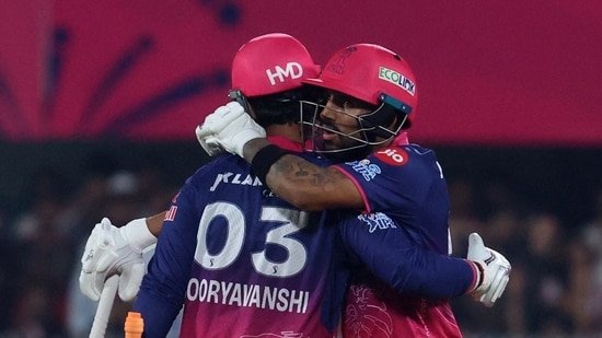 RR vs RCB LIVE Score: Dhruv Jurel embraces Vaibhav Sooryavanshi during their partnership.