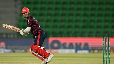 avid Warner watches the ball after playing a shot during a PSL 2026 match. (AFP)