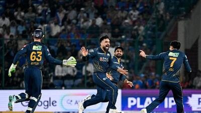 Gujarat Titans' Rashid Khan and teammates celebrate the wicket of Delhi Capitals' Sameer Rizvi during their IPL. (ANI)