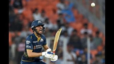 Gujarat Titans' captain Shubman Gill reacts after playing a shot against Mumbai Indians at the Narendra Modi Stadium in Ahmedabad. (AFP)