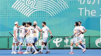 HANGZHOU, CHINA - OCTOBER 06: Harmanpreet Singh #13 of India celebrate a goal with teammate during the Asian Games Men's Final Hockey event match between Japan and India at Gongshu Canal Sports Park Gymnasium on October 06, 2023 in Hangzhou, China. (Photo by Lintao Zhang/Getty Images) (Getty Images)