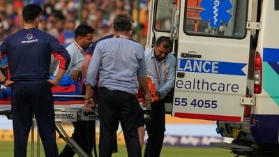 Lungi Ngidi is taken in an ambulance after he was injured during the IPL match between DC and PBKS. (AP)