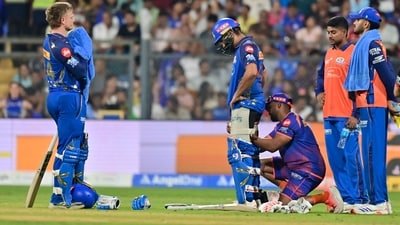 Mumbai Indians' Rohit Sharma getting treated from physio during the 2026 IPL cricket match between MI Vs RCB at Wankhade Stadium in Mumbai (Anshuman Poyrekar/HT Photo)