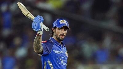Mumbai Indians' Tilak Varma celebrates his half-century during the Indian Premier League 2026 match against Gujarat Titans at Narendra Modi Stadium, in Ahmedabad on Monday. (ANI)