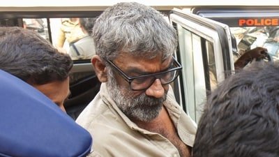 Malayalam film director Ranjith while being taken to a sub-jail after a medical check-up at Ernakulam General Hospital. He was arrested in connection with an attempted sexual assault case. (PTI)