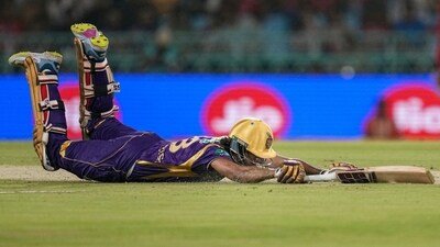 Kolkata Knight Riders' Angkrish Raghuvanshi dives to reach the crease during the IPL match against Lucknow Super Giants (PTI)