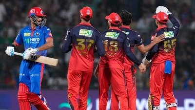 Delhi Capitals' Axar Patel walks back to the pavilion after his dismissal by Royal Challengers Bengaluru's Bhuvneshwar Kumar during the IPL match (PTI)