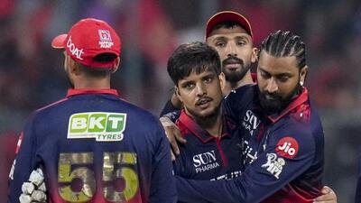 RCB's Rasikh Salam, centre, with teammates celebrates after the wicket of LSG's Avesh Khan. (PTI) RCB's Rasikh Salam, centre, with teammates celebrates after the wicket of LSG's Avesh Khan. (PTI)