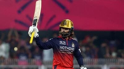 Royal Challengers Bengaluru's Rajat Patidar celebrates after reaching his half century. (REUTERS)