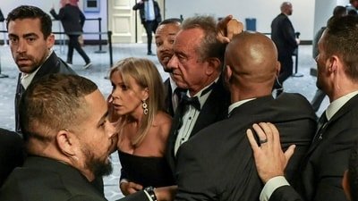 Security officials evacuate U.S. Health and Human Services (HHS) Secretary Robert F. Kennedy Jr. and his wife, Cheryl Hines, as a shooter opens fire during the annual White House Correspondents' Association dinner in Washington, D.C., U.S., April 25, 2026. REUTERS/Jonathan Ernst (REUTERS)