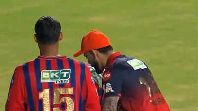 Photo/screengrab Touching moment: Virat Kohli stunned as LSG youngster tries to touch RCB batter's feet - Watch