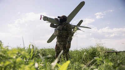 KHARKIV REGION, UKRAINE - MAY 22: (EDITOR'S NOTE: Image has been reviewed by Ukrainian military officials prior to transmission) Members of the Lava Unmanned Systems Regiment, Norman, poses for a photograph with a Bulava strike drone, a kamikaze UAV capable of carrying a 3.5-kilogram payload with a range of up to 100 kilometres, on May 22, 2026 in Kharkiv region, Ukraine. The Lava Unmanned Systems Regiment, part of the 2nd Khartiia Corps of the Ukrainian National Guard, is a specialized unit focused on combat operations using drones and robotic systems, including deep reconnaissance and precision strikes behind enemy lines. Originally formed as a battalion in 2025, the unit was expanded into a regiment in 2026 as Ukraine increasingly relies on unmanned technologies in warfare. (Photo by Diego Fedele/Getty Images) How to destroy drones electronically, without firing bullets
