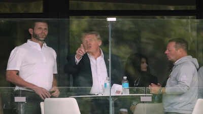 Eric Trump, President Donald Trump and Larry Glick watch the Maaden LIV Golf tournament at Trump National Golf Club, in Sterling, Va. AP/PTI(AP05_10_2026_000001A) TACO abroad, boss at home: Trump may be losing against China or Iran, but still controls MAGA
