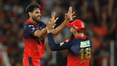 Bhuvneshwar Kumar and Virat Kohli celebrate after taking a Gujarat Titans wicket in the IPl 2026 final. (Pic credit: IPL) IPL final: How Bhuvneshwar Kumar, Josh Hazlewood and Rasikh Dar blew GT away with a bowling masterclass