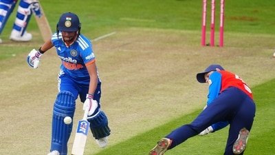 England's Amy Jones attempts to run out India's Harmanpreet Kaur. (David Davies/PA via AP) England's Amy Jones attempts to run out India's Harmanpreet Kaur. (David Davies/PA via AP)
