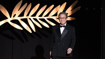 President of the jury South Korean director Park Chan-wook arrives on stage during the Opening Ceremony at the 79th edition of the Cannes Film Festival.
(Photo by Sameer AL-DOUMY / AFP) (AFP) President of the jury South Korean director Park Chan-wook arrives on stage during the Opening Ceremony at the 79th edition of the Cannes Film Festival.
(Photo by Sameer AL-DOUMY / AFP) (AFP)