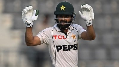 Muhammad Rizwan reacts after scoring a half-century (50 runs) during the fourth day of the second Test cricket match between Bangladesh and Pakistan in Sylhet (AFP)