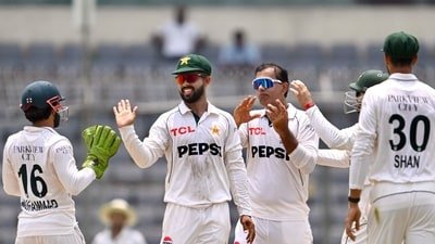 Pakistan's Noman Ali (C) celebrates with teammates after taking the wicket of Bangladesh's captain Najmul Hossain Shanto during the fifth day of the first Test (AFP)