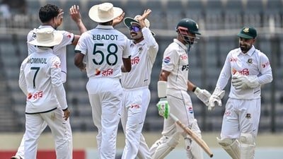 Bangladesh's captain Najmul Hossain Shanto (C) celebrates with teammates after the dismissal of Pakistan's captain Shan Masood (2R) during the third day of the first Test (AFP) Bangladesh's captain Najmul Hossain Shanto (C) celebrates with teammates after the dismissal of Pakistan's captain Shan Masood (2R) during the third day of the first Test (AFP)