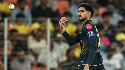 Shubman Gill tosses the ball (AFP)