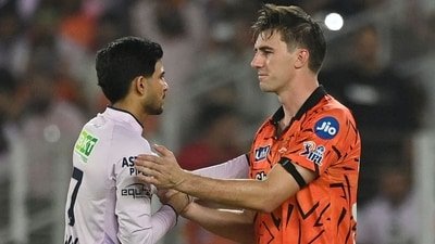 Gujarat Titans' captain Shubman Gill (L) is congratulated by his Sunrisers Hyderabad's counterpart Pat Cummins for his team's win at the end of their 2026 IPL match (AFP)
