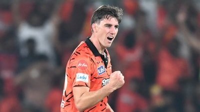 Sunrisers Hyderabad's captain Australian cricket player Pat Cummins celebrates after taking the wicket of Punjab Kings' Indian cricket player Priyansh Arya (AFP)