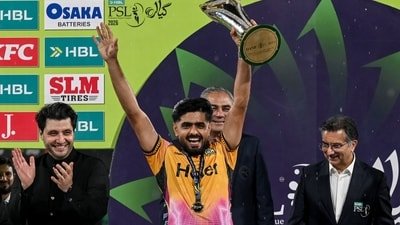 Peshawar Zalmi captain Babar Azam celebrates with the PSL trophy (AFP)