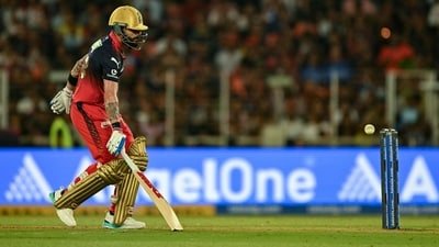 Virat Kohli limps while taking a single. (AFP) Virat Kohli limps while taking a single. (AFP)