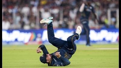 Gujarat Titans’ Rashid Khan takes the catch of Royal Challengers Bengaluru's Virat Kohli. (PTI)