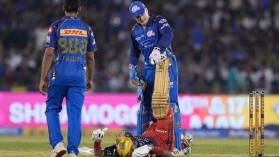 Mumbai Indians' Ryan Rickelton helps Royal Challengers Bengaluru's Krunal Pandya. (AP)