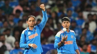 India's captain Harmanpreet Kaur (L) with Kranti Goud during the ICC Women's Cricket World Cup in Navi Mumbai, India, Sunday. (AP)
