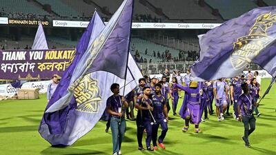 Kolkata Knight Riders’ Rinku Singh (C) walks with the team flag. (AFP) Kolkata Knight Riders’ Rinku Singh (C) walks with the team flag. (AFP)