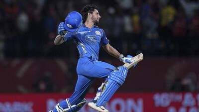 Mumbai Indians' Tilak Varma celebrates after taking his team to victory against PBKS. (PTI)