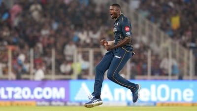 Gujarat Titans' Jason Holder celebrates after taking a wicket of Royal Challengers Bengaluru's Jitesh Sharma during an IPL game (PTI)