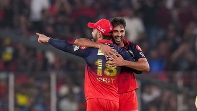 Royal Challengers Bengaluru's Virat Kohli and Bhuvneshwar Kumar celebrate a wicket during an Indian Premier League (IPL) 2026 match (PTI)