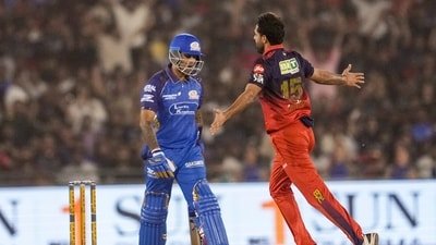 Royal Challengers Bengaluru's Bhuvneshwar Kumar celebrates after taking the wicket of Mumbai Indians' captain Suryakumar Yadav during an IPL 2026 match (PTI)