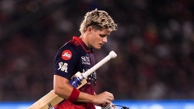 Royal Challengers Bengaluru's Jacob Bethell returns to the pavilion after his dismissal by Kolkata Knight Riders' Kartik Tyagi (PTI)