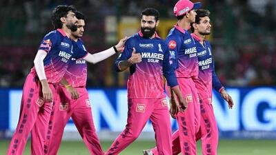Rajasthan Royals players celebrate with Ravindra Jadeja (C) after he removed Delhi Capitals batter Pathum Nissanka in their IPL game in Jaipur on Friday. (AFP)