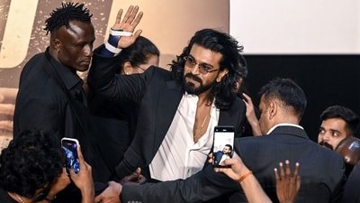Ram Charan sported a brace on his hand at the trailer launch of Peddi in Mumbai. (AFP) Ram Charan sported a brace on his hand at the trailer launch of Peddi in Mumbai. (AFP)