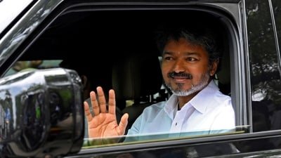 Actor-turned-politician Vijay, president of Tamilaga Vettri Kazhagam (TVK), waves as he arrives at his party’s office. (REUTERS)