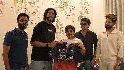 Allu Arjun's son Allu Ayaan receiving the jersey from Venkatesh Iyer. Allu Arjun's son Allu Ayaan receiving the jersey from Venkatesh Iyer.