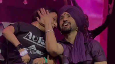 Diljit Dosanjh's heartwarming moment with a fan wins the internet as he sings 'Hass Hass' live for her - Watch