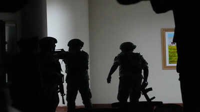 Philippine troopers exchange fire along a hallway at the Philippine Senate in Pasay, Philippines on Wednesday May 13, 2026. (AP Photo/Aaron Favila) Gunshots heard at Philippine Senate as Duterte aide, accused of crimes against humanity, tries to evade arrest for ICC trial - watch