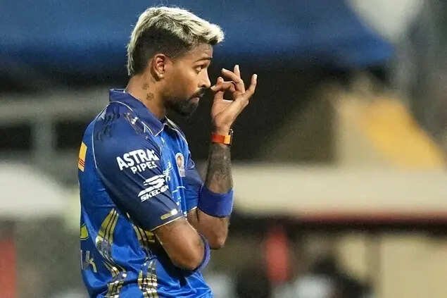 Hardik Pandya reacts after RCB's captain Rajat Patidar hits a six during the IPL match between MI and RCB, in Mumbai.